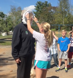 Mrs. Cain getting pied in the  face by Lily!